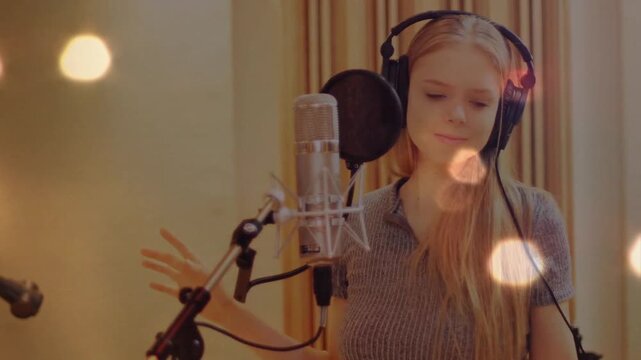 Music studio singer adjusting headphones and breathing before singing into microphone with curtains
