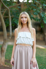 portrait of slim romantic style woman blonde outdoors in summer