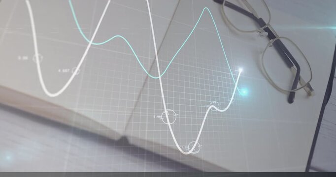 Opening notebook activating holographic grid and dual-line graph animating to show data trends - Powered by Adobe