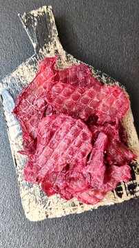 Jerky or dried chicken and cherry snacks. Dehydrated, dried snacks for beer or for your pets