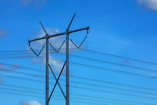 High voltage power lines and support poles - Powered by Adobe