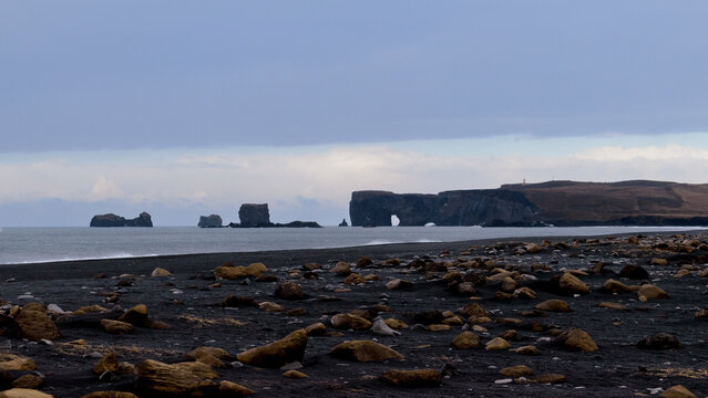 Black Sand Beach with Natural Rock Arch Dyrh&oacute;laey Iceland Coast