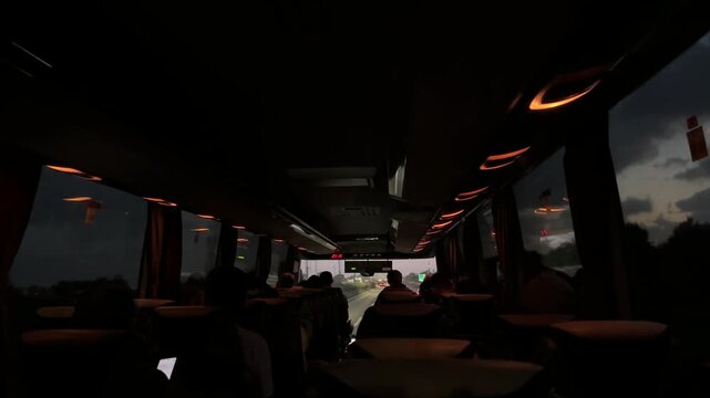Large regular intercity bus with tourists. Tourist international transport. The interior of the bus, people passengers on a city tour. Transportation of employees to work.