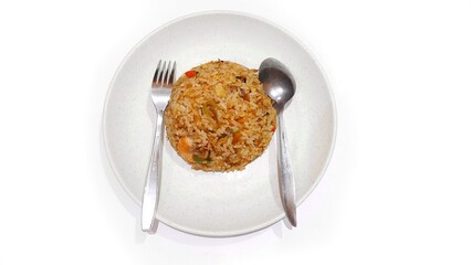 Seafood fried rice served on white plate isolated on white background. Food presentation business