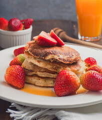 Stack of Pancakes with Strawberries and Syrup