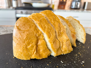 Close-up of French bread slices on kitchen counter