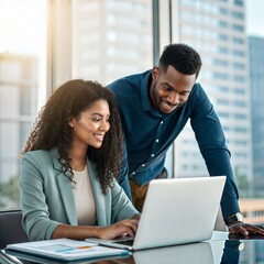 Diverse business professionals collaborating on a laptop in a modern office