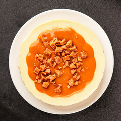 Cheesecake salted caramel sweet dessert fresh delicious gourmet food background on the table rustic food top view copy space