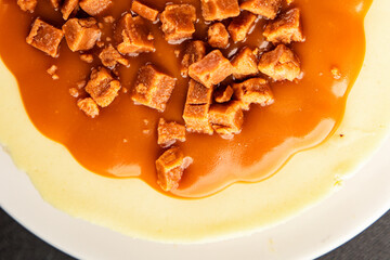 Cheesecake salted caramel sweet dessert fresh delicious gourmet food background on the table rustic food top view copy space