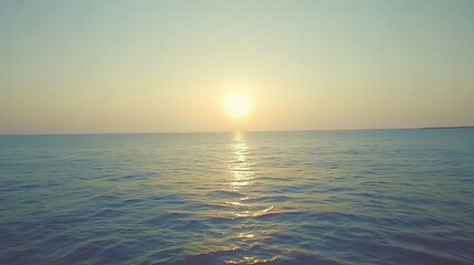 Obraz premium Tranquil sunset over the ocean