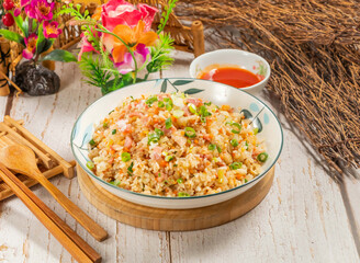 Classic Bacon and Egg Fried Rice with Dipping Sauce in plate side view of Asian Comfort Food Meal