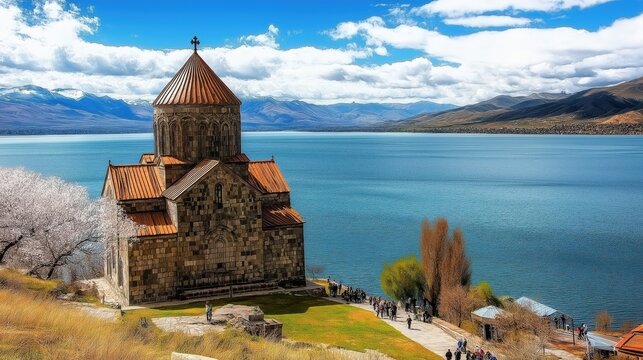 Scenic view of Sevanavank monastery on the shore of Lake Sevan in Armenia with ancient stone church and mountainous landscape.