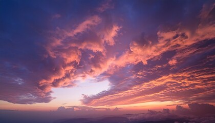 clouds sunset sky atmospheric nature scene vibrant orange and pink colors weather phenomenon dramatic sky background for travel and outdoor photography
