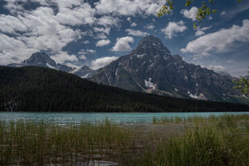 Waterfowl Lake in Alberta’s Canadian Rockies on a Bright Blue Sky Day with Reflections and Mountain Peaks
