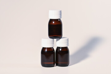 Three Brown Glass Bottles for Medicine on White