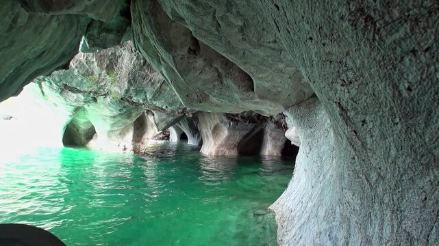 Embark on a boat trip. Discover the beauty of the stunning rock formations. Marvel at the vivid blue-green water. Explore the depths of the caves in Patagonia.