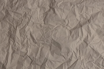 Empty crumpled crack grain beige gray paper blank texture copy space wall background.