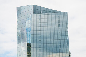 Modern glass office building in vilnius lithuania with contemporary architecture and reflective windows used for commercial business and corporate headquarters in urban city environment