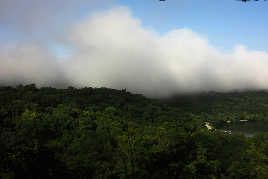rolling clouds over forest