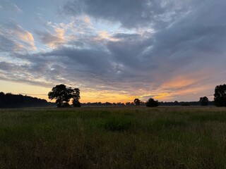 fantastic sunset in the field, twilights sky in the summer field