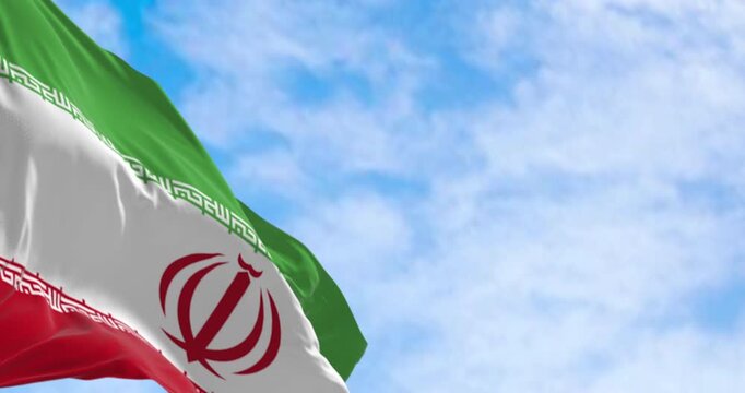 Islamic Republic of Iran national flag waving on a clear day