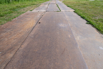 Obraz premium steel plates on a meadow as temporary road
