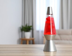 Red lava lamp on a wooden table (2)