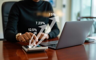 Financial professional analyzing business data on a calculator with a digital overlay showing growth percentages and upward arrows.