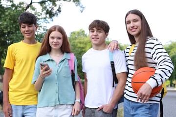 Group of teenagers walking together in park