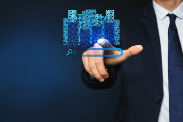 Real estate agent using virtual screen with search bar and buildings against dark blue background, closeup. Searching for housing online