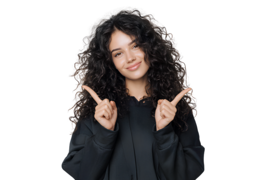 Confident Young Woman with Curly Hair Pointing Down and Smiling, Studio Pose, Transparent PNG.. - Powered by Adobe
