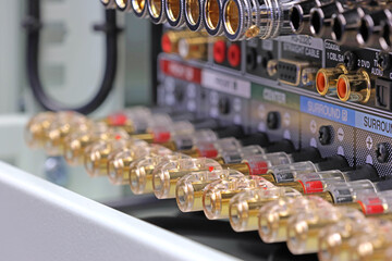 Rear panel of a high-quality AV receiver with multimedia connections for connecting speakers, analog and digital signals. 