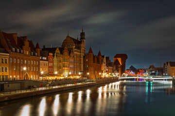 Colorful facades and promenade in Gdańsk Old Town at night © Dreamnordno