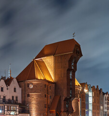 The Crane in Gdańsk illuminated at night with dramatic cloudy sky © Dreamnordno