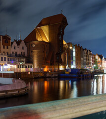 Gdańsk waterfront at night with Żuraw Crane and cloudy sky © Dreamnordno