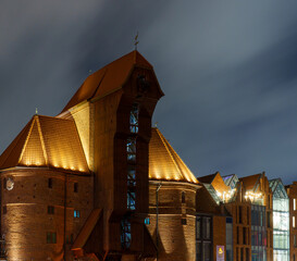 The Crane in Gdańsk illuminated at night with dramatic cloudy sky © Dreamnordno