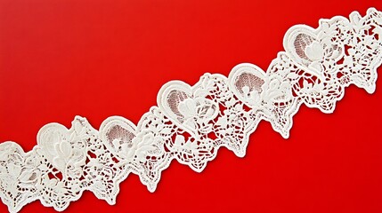 Ornate lace trim against a vibrant red backdrop