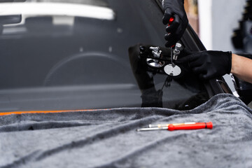 Resin repair on windshield using injector application to restore structural clarity. Windshield...