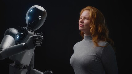 Futuristic Human-Machine Concept: Visualization of Young Woman Speaking with Advanced Humanoid...