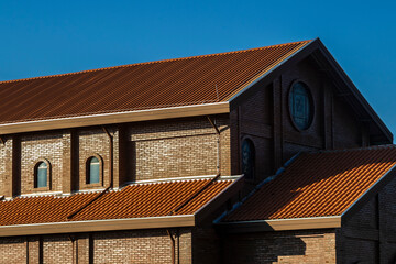Facade of the church built with bricks in view of the Divina Misericordia Monastery, in rural area...