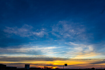 Silhouette of traffic sign on the roadway during a sunset in Brazil
