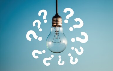 A bright idea a lightbulb surrounded by question marks, symbolizing curiosity and the search for answers