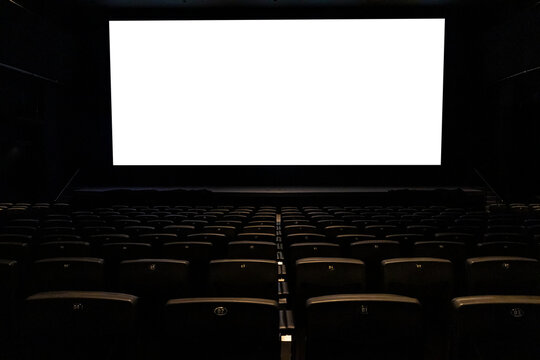Cinema with black chairs with white blank screen in Brazil. Mockup of hall, no people and auditorium