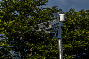 Urban surveillance and traffic monitoring cameras on metal poles in Brazil. Devices help improve public safety, vehicle control, and city management through smart technology.