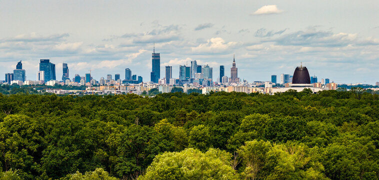 Panoramic view of downtown center and financial district skyscrapers of Warsaw, Poland above Royal Wilanow residential district