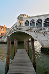 Venice, Grand Canal, view of Rialto Bridge and Palaces. Reflection in water.