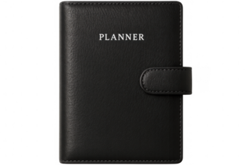 Black leather planner with securing strap, representing professional planning and organizational efficiency
