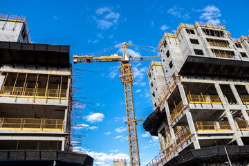 crane carries some products at a construction site in a city in Brazil
