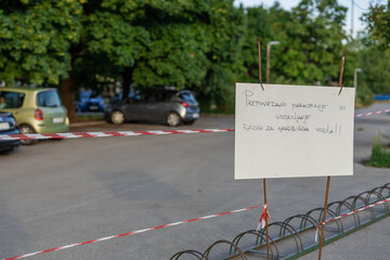 Hand written sign in slovenian prohibiting parking of cars on this parking spot around future athletic centre in ljubljana