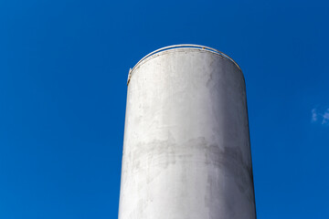 Concrete water reservoir against a clear blue sky. Essential for water supply and distribution in Brazil